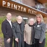 The Prinzen family (John and Siny, centre) in front of Prinzen Flats