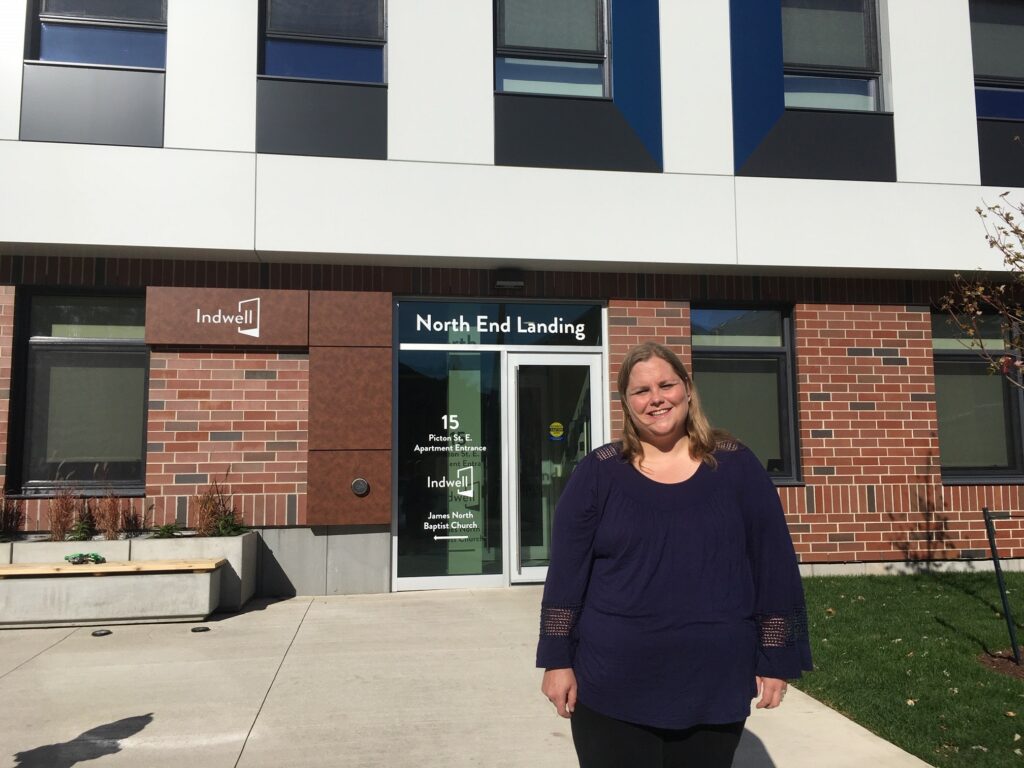 Stacey at North End Landing - 2020 - in front of brick building