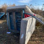 A picture of homelessness bed mattresses and wooden pallet constructed into a fort