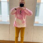 Mary, tenant at Harvey Woods Lofts, Woodstock, wearing a mask in a hallway