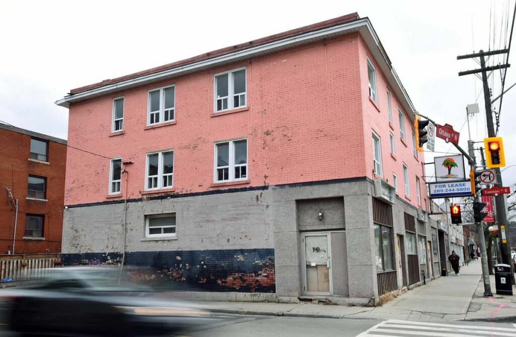 salmon coloured brick exterior of 180 Ottawa St, Hamilton - to become 12 units of housing