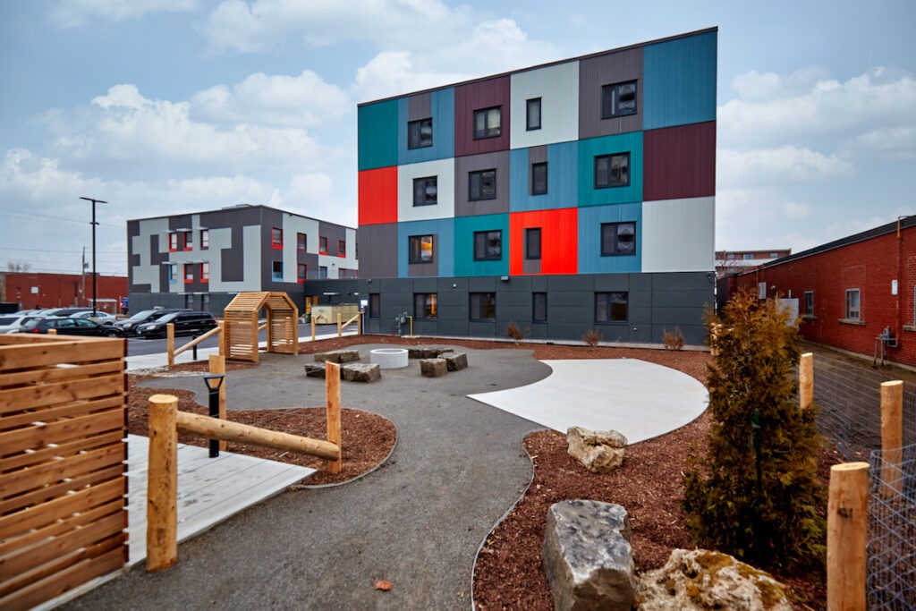 Outdoor community space at McQuesten Lofts in Hamilton - gardens and fire pit